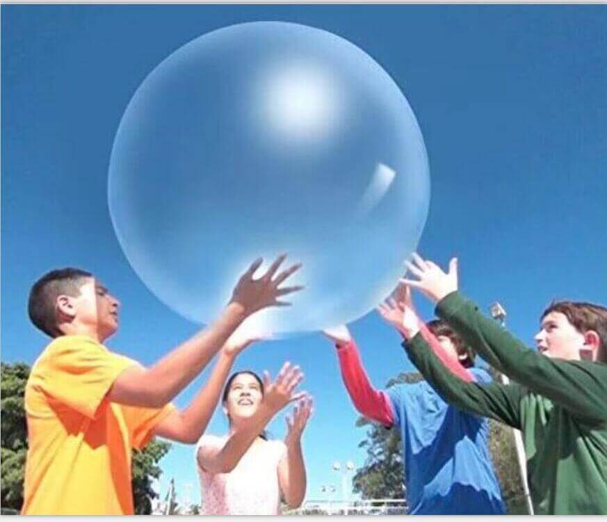 Children playing with a Big Inflatable Ball Children's Toy Elastic Ball Water Ball Bubble Ball Inflatable Ball outdoors.