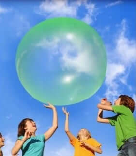 Big Inflatable Ball Children's Toy Elastic Ball Water Ball Bubble Ball Inflatable Ball being played with by children outdoors.