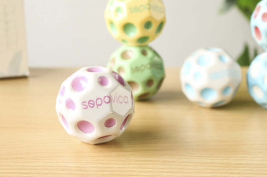 Colorful Bouncy Ball Toy Ball on a wooden surface, perfect for juveniles aged 7-14 years.