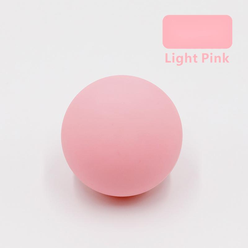 Silicone single ball Fascia ball massage ball in light pink color on a white background.