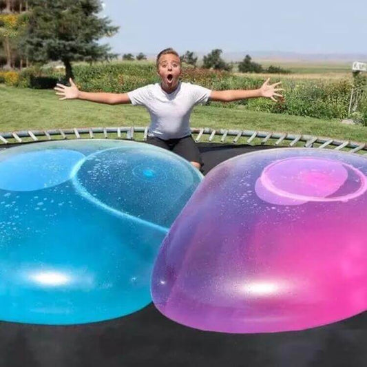 Big Inflatable Ball Children's Toy Elastic Ball Water Ball Bubble Ball Inflatable Ball on a trampoline with a child.