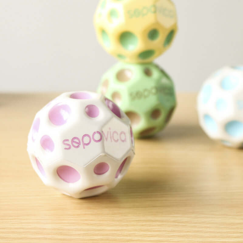 Bouncy Ball Toy Ball in multiple colors with holes, designed for kids aged 7-14 years, made of PU material.