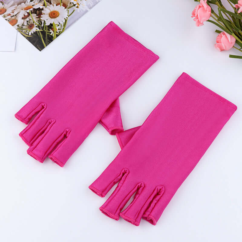 Manicure UV Protection Glove in vibrant pink color with half-finger design for stylish nail care.