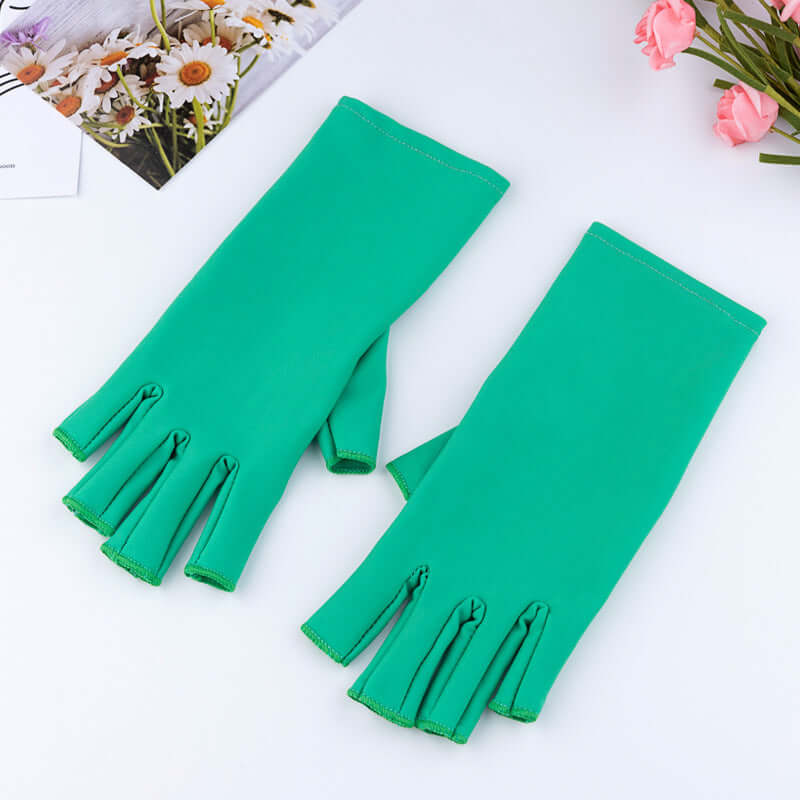 Manicure UV Protection Glove in green cloth material, half-finger design for enhanced UV protection while manicuring.